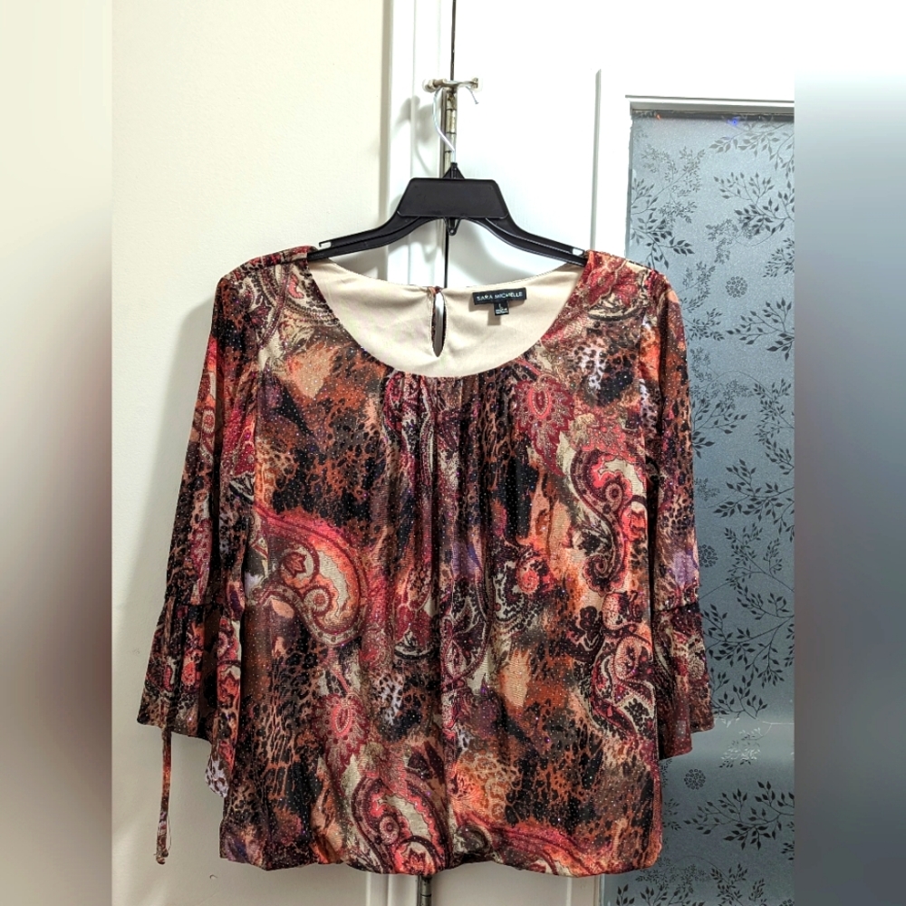 Sara Michelle pullover Blouse with Paisley and Coral like pattern.  Sparkles .